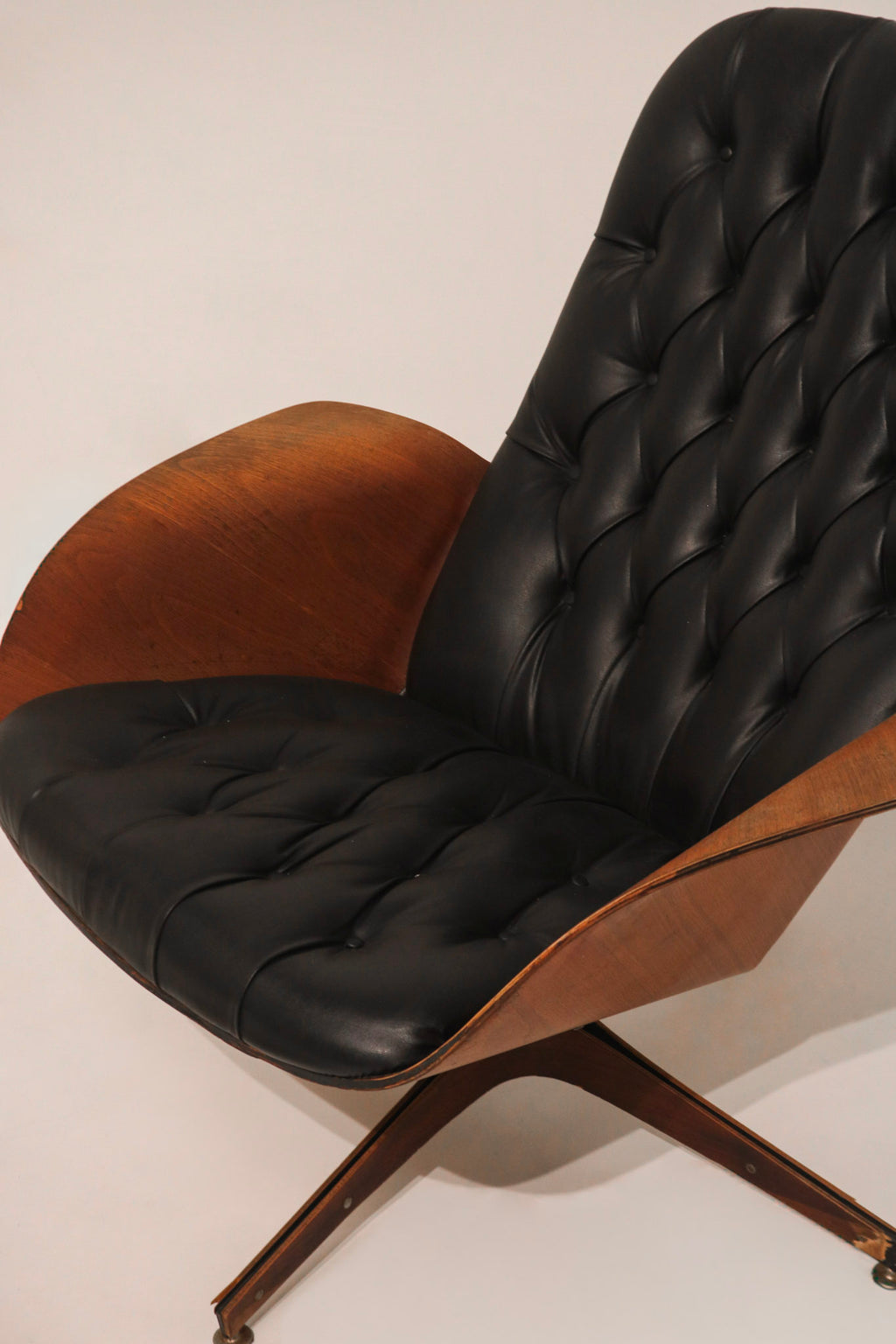 Detail showing the matching design elements of chair and ottoman