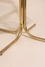 Close-up detail of the plastic floor glides on the tubular metal chair base