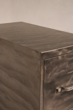 Close-up of closed metal drawer fronts showing brushed finish texture