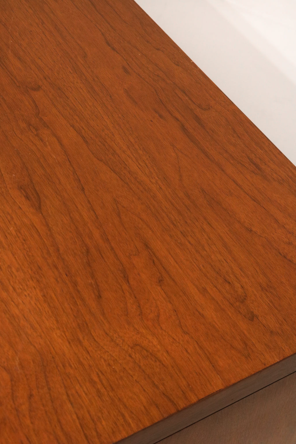 Close-up of wear and missing wood detail on the right corner edge