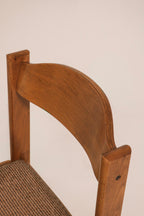 Detail of curved solid oak backrest showing wood grain and finish
