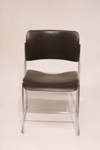 Front view of single David Rowland 40/4 chair showing chrome frame and black seat