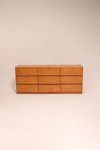Full view of vintage solid oak 9 drawer dresser with warm wood tones and classic design