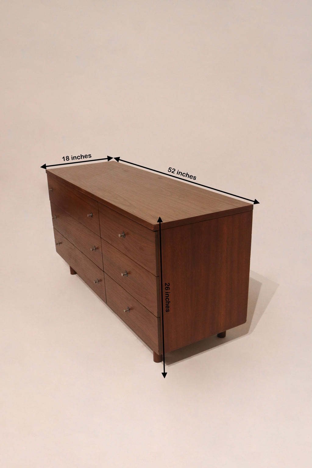 Size reference of the Mcm walnut wood lowboy dresser showing 52 inches long, 18 deep, and 26 high