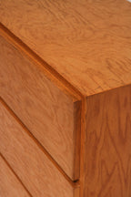 Detail of wooden drawer edge with oak finish and vintage wear marks