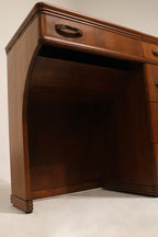 Detail: tabletop edge profile and veneer condition on walnut wood desk showing minor wear and consistent vintage character
