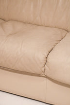 Back bottom area of the leather Natuzzi couch showing minor wear as described