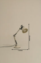White metal desk lamp with adjustable arm and head