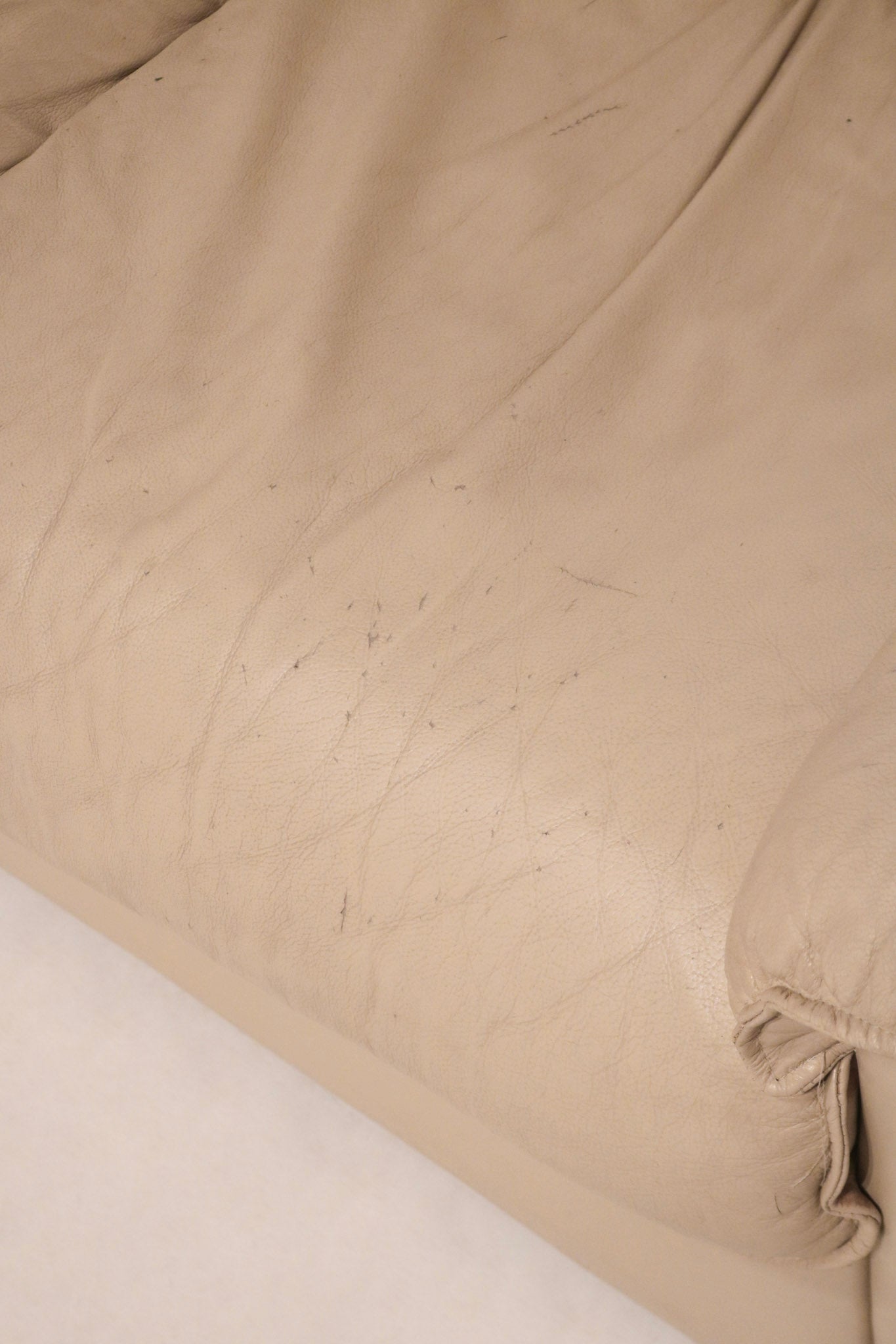 Side view of vintage Salotti Natuzzi sofa showing armrest design and leather quality