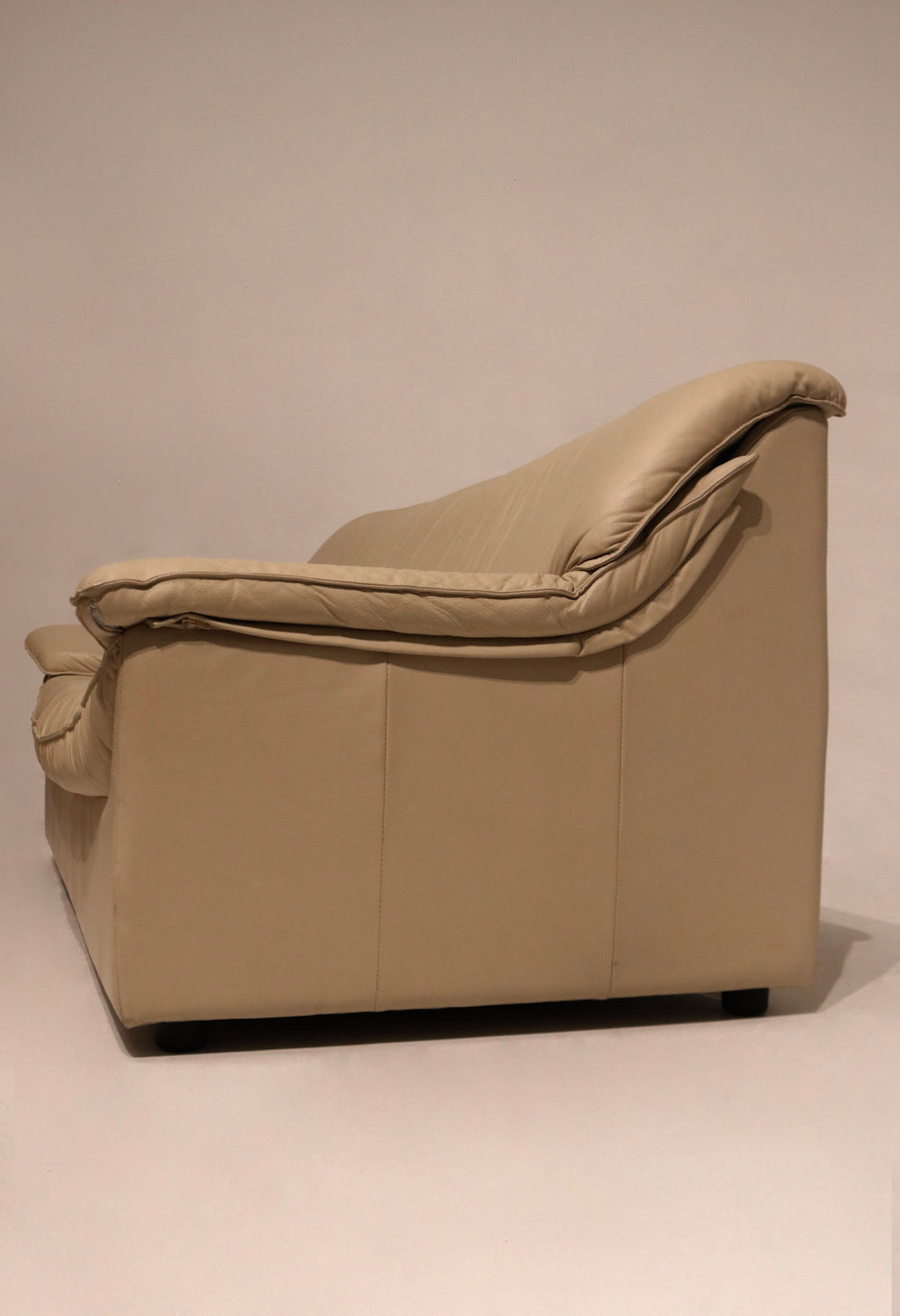 Side profile image of Vintage Italian Beige Sofa, highlighting clean lines and leather wrap