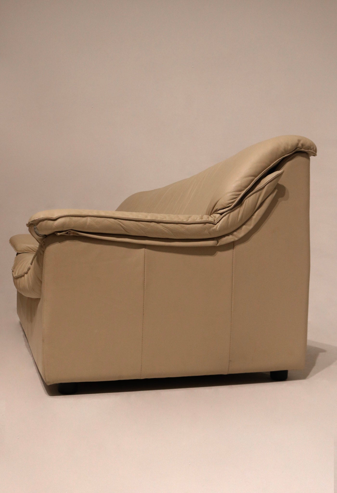 Side profile image of Vintage Italian Beige Sofa, highlighting clean lines and leather wrap