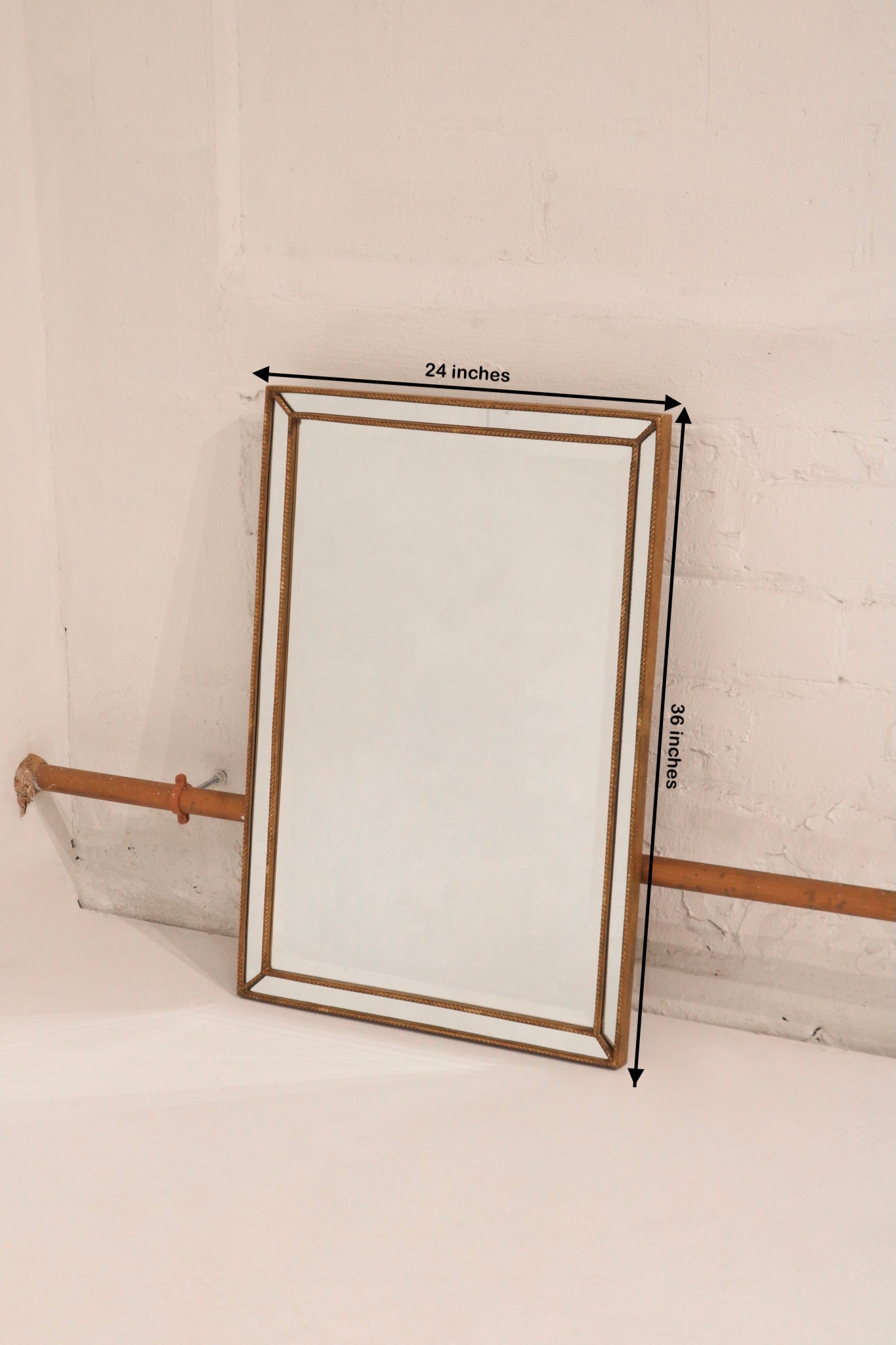 Dimensions of vintage wall mirror: 36 inches by 24 inches, shows proportions and scale for decor planning