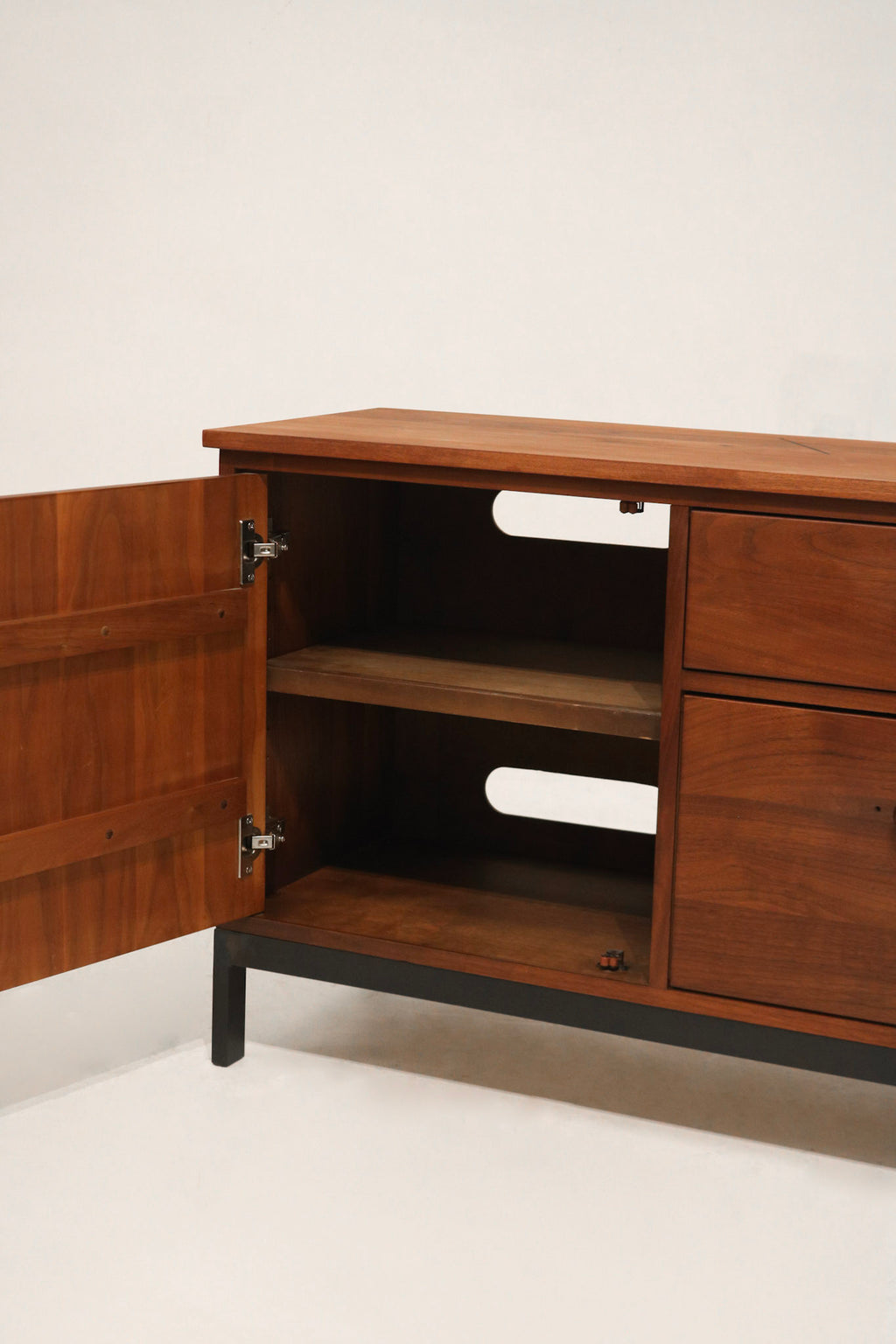 Base detail with focus on iron leg construction and connection to frame