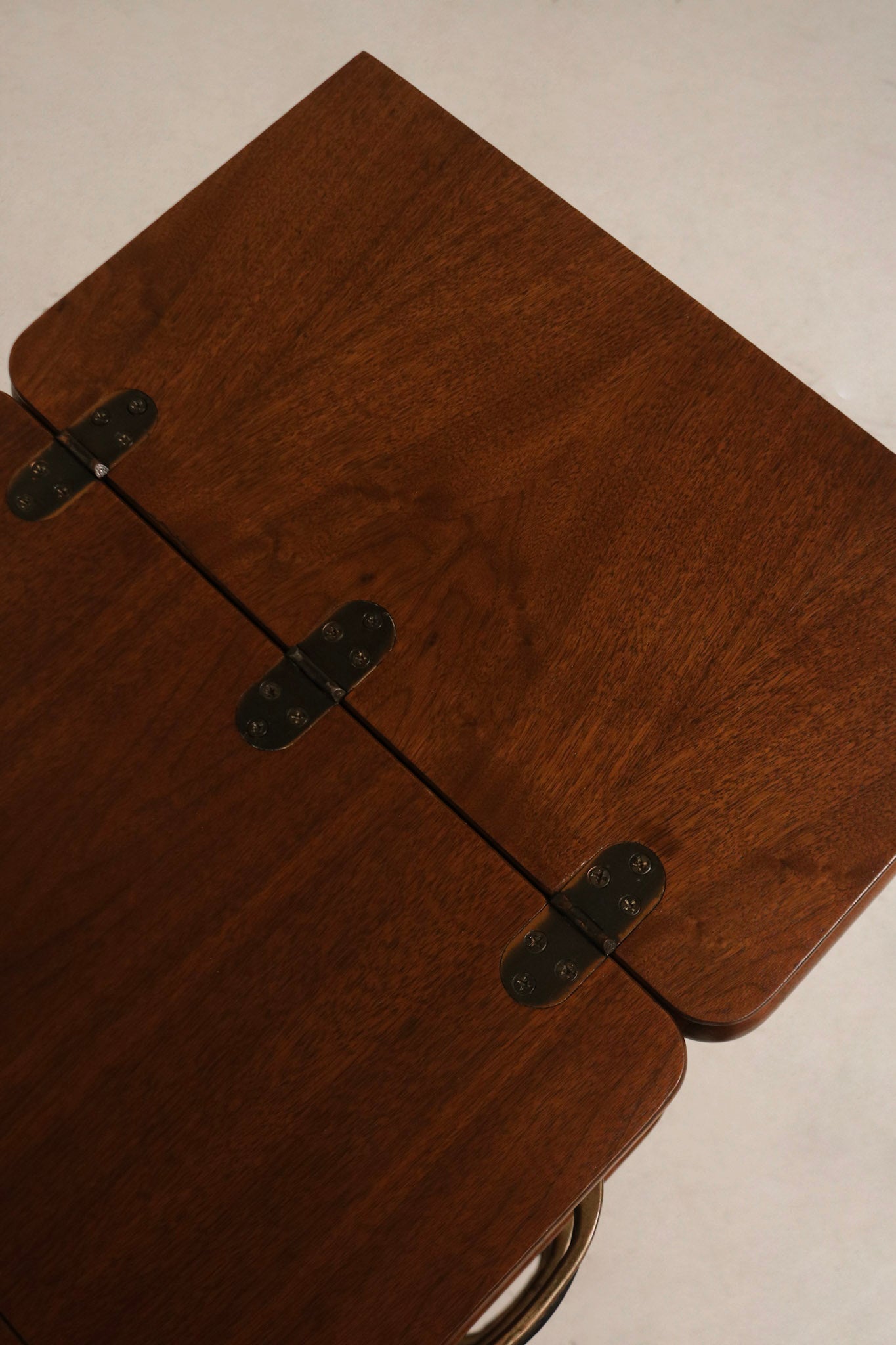 Detail: interior compartment where sewing machine likely sat, walnut wood cavity with original joinery and storage space