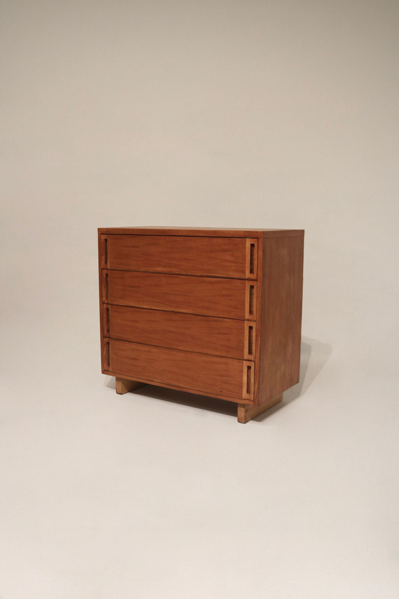 Main front view of vintage solid wood dresser chest of drawers with stained walnut finish, sturdy frame and four spacious drawers