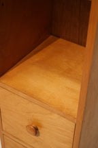 Side panel detail showing texture contrast between oak and particle board