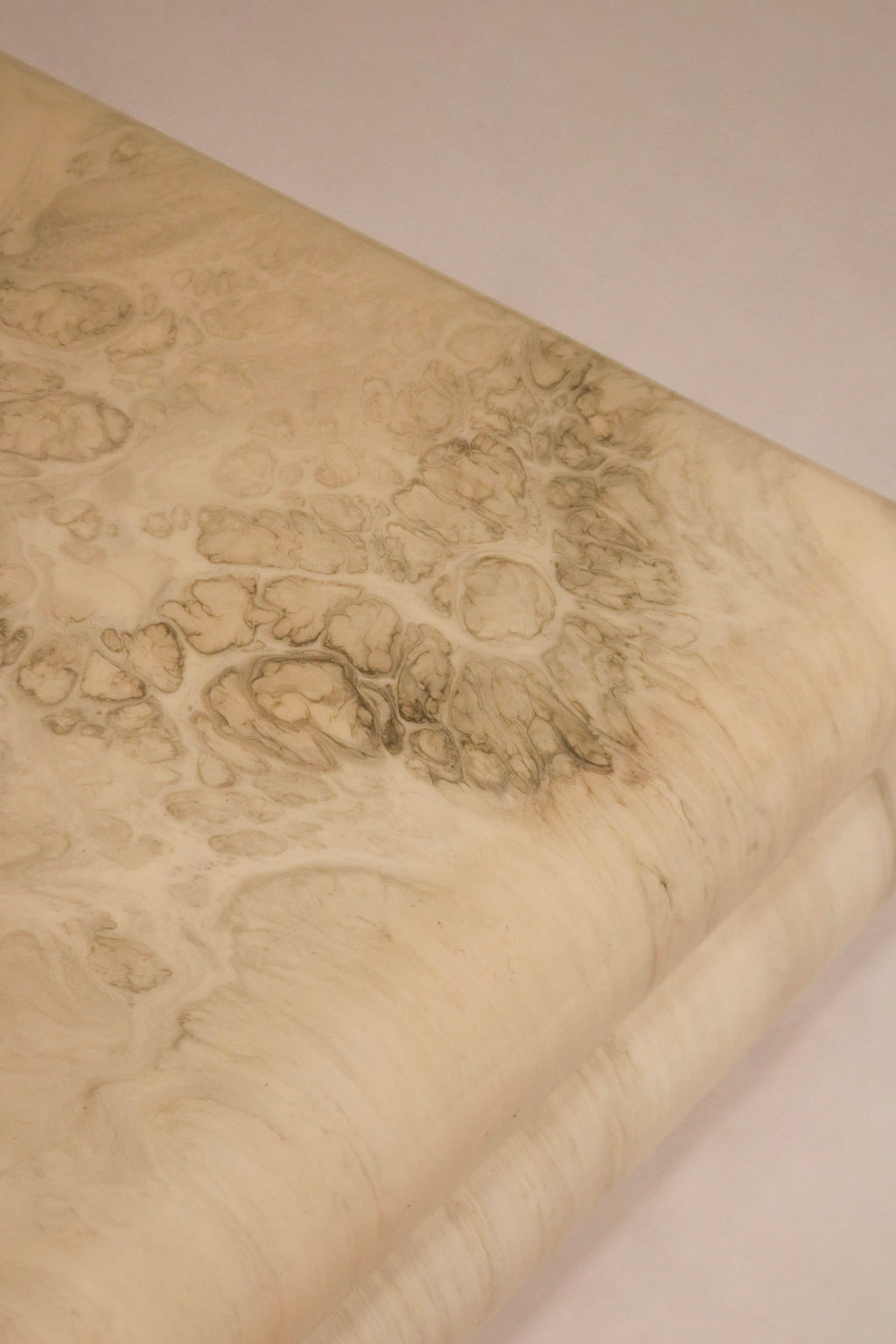 Top-down view capturing the wide square surface and swirling marbled resin pattern