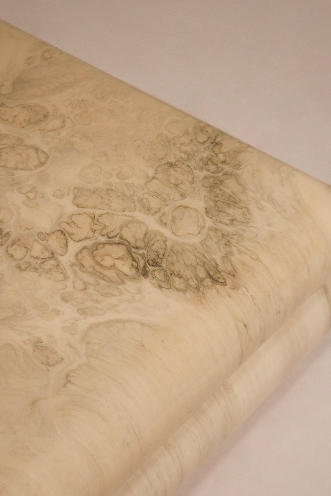 Top-down view capturing the wide square surface and swirling marbled resin pattern