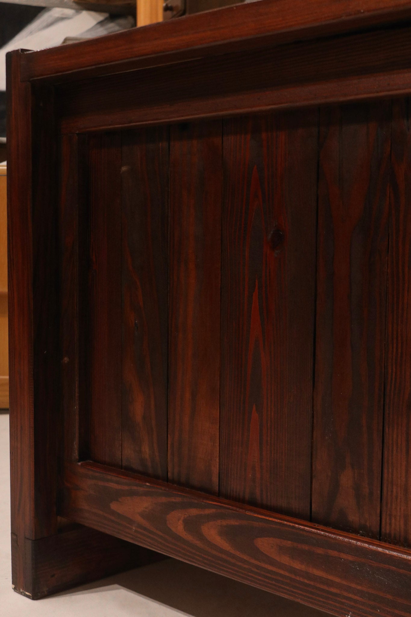 Underside view of the desk table showing solid oak support beams and construction