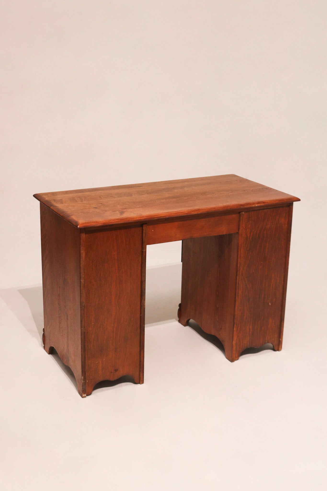 Close-up of maple wood grain on 1950s vintage desk surface showing realistic texture