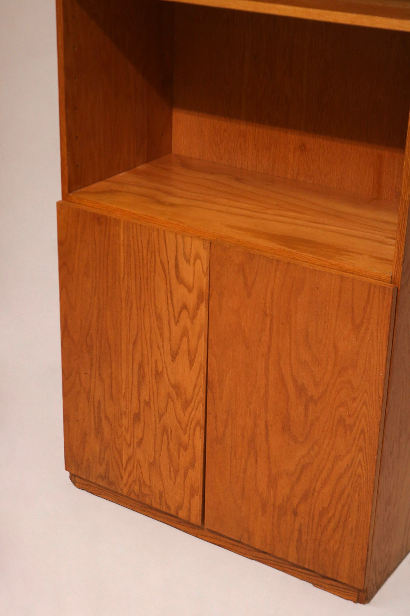 Detail of sturdy oak wood construction on the bottom section of the tall Mcm bookcase