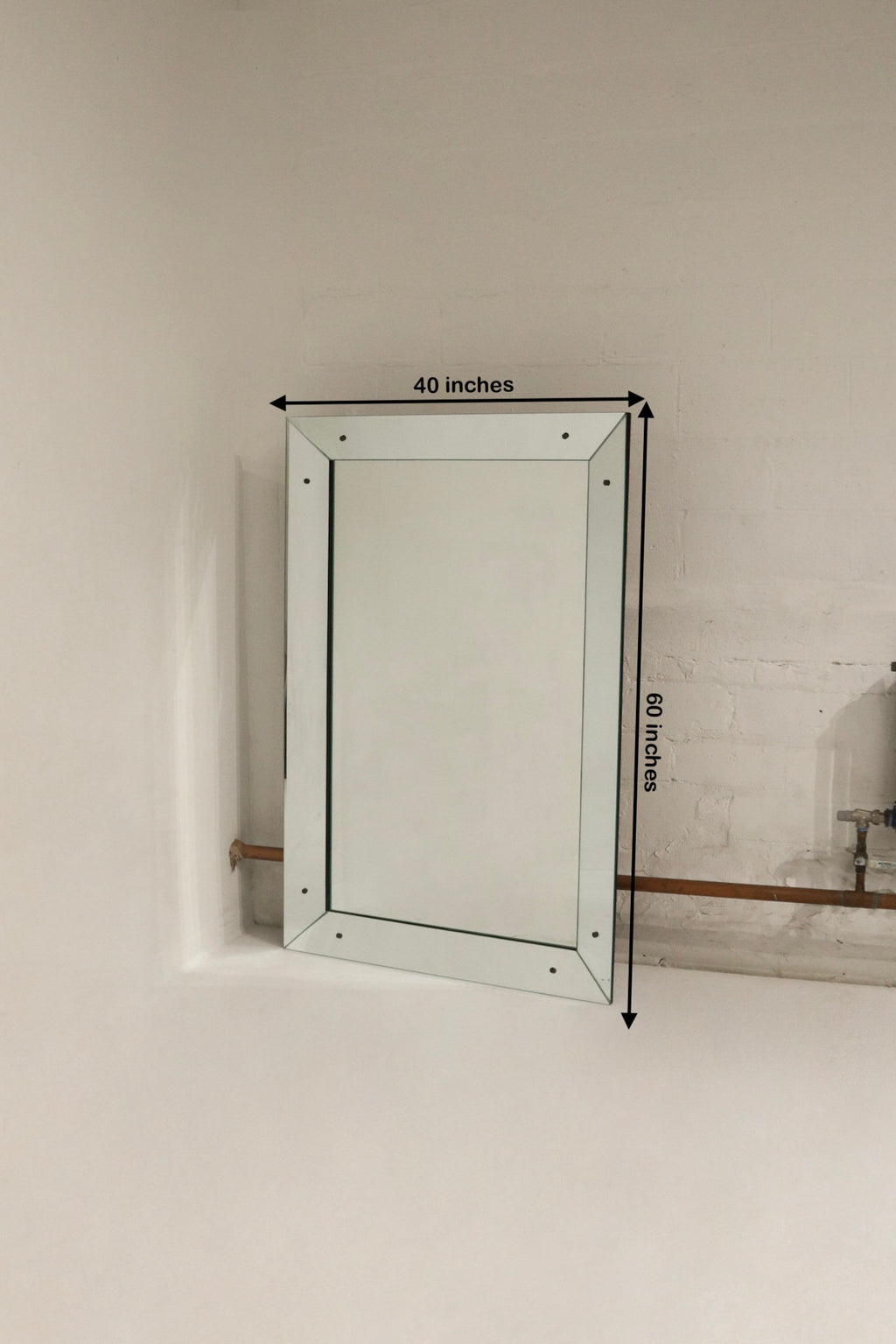 Heavy mirror with hardware for wall mounting
