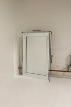 Heavy mirror with hardware for wall mounting