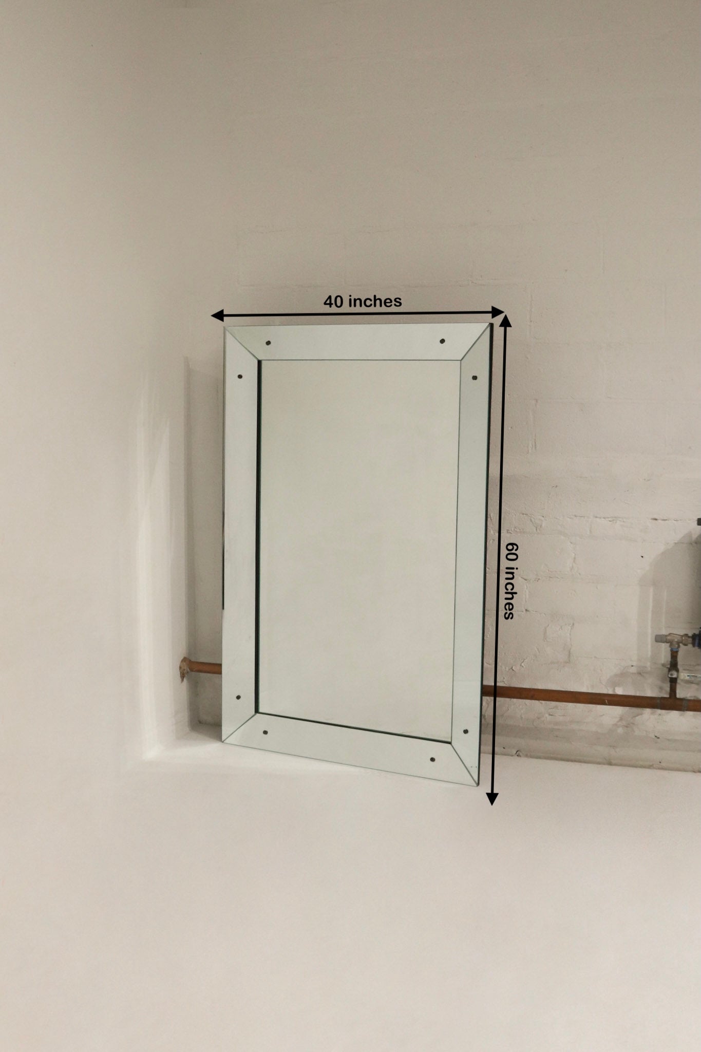 Heavy mirror with hardware for wall mounting