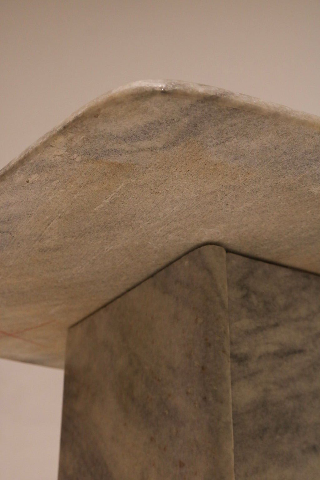Close-up of marble texture showing natural stone pattern and polished surface on side table