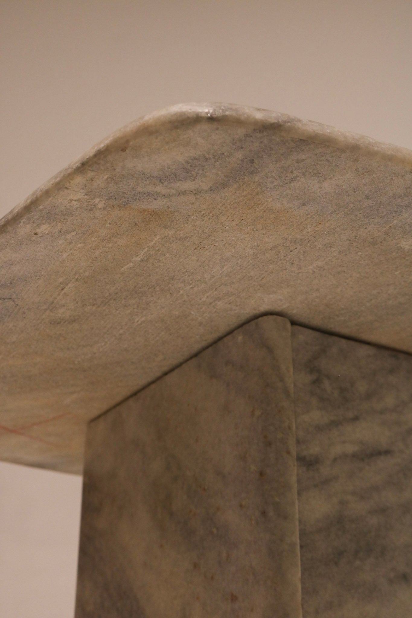 Close-up of marble texture showing natural stone pattern and polished surface on side table