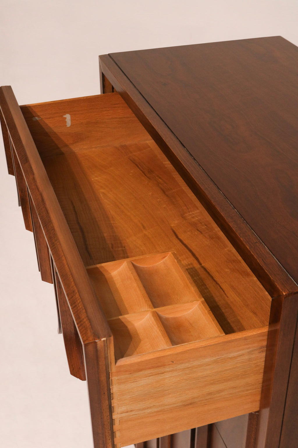 Top surface view highlighting minor dark mark and rich walnut wood tones