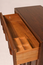 Top surface view highlighting minor dark mark and rich walnut wood tones