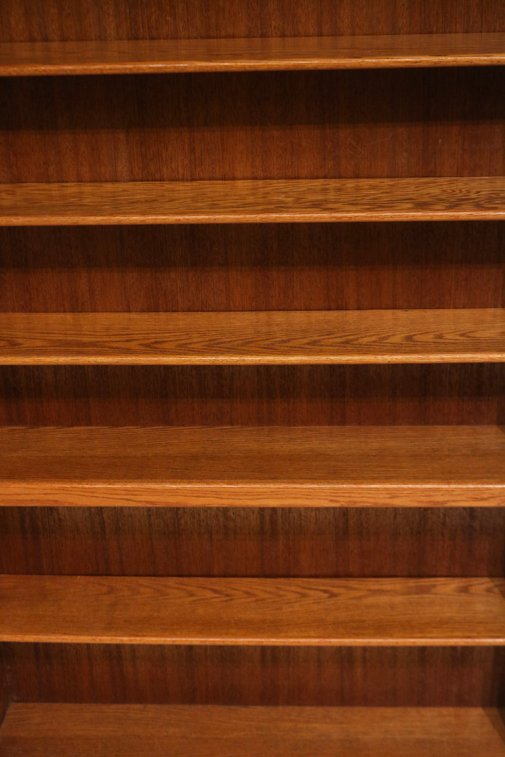 Photo with measuring tape showing large dimensions of tall wood cabinet