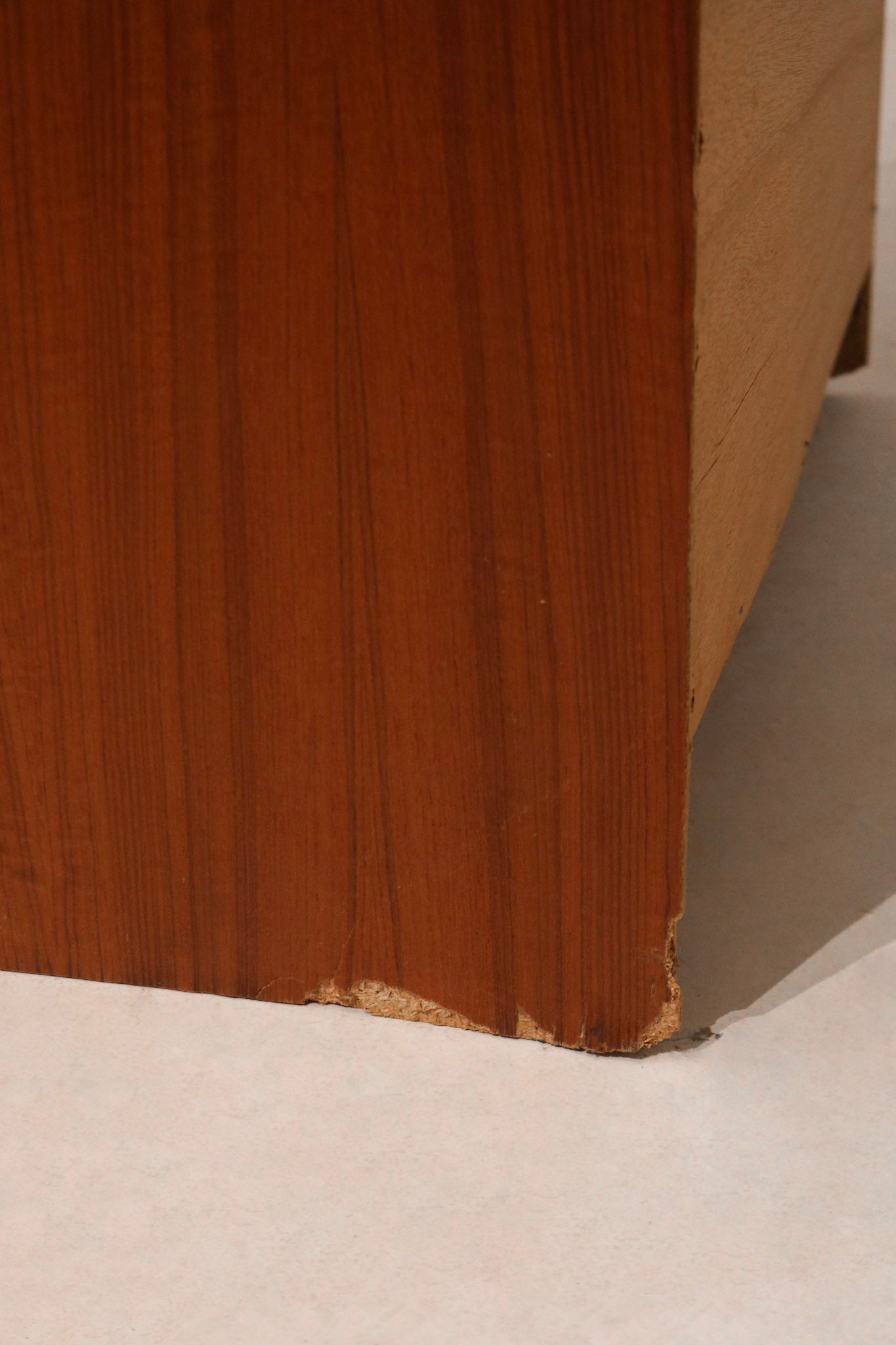 Inside of drawer revealing spacious and clean storage compartments in wooden unit