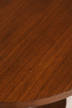 Close-up of table leg and joint area showing robust wood build and slight wear