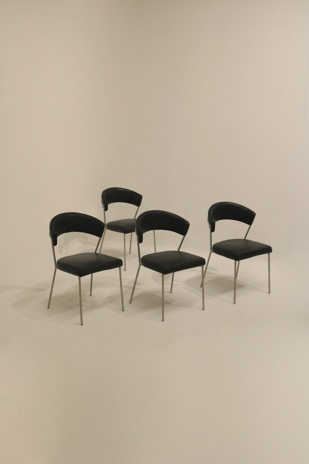 Set of 4 black vinyl dining chairs