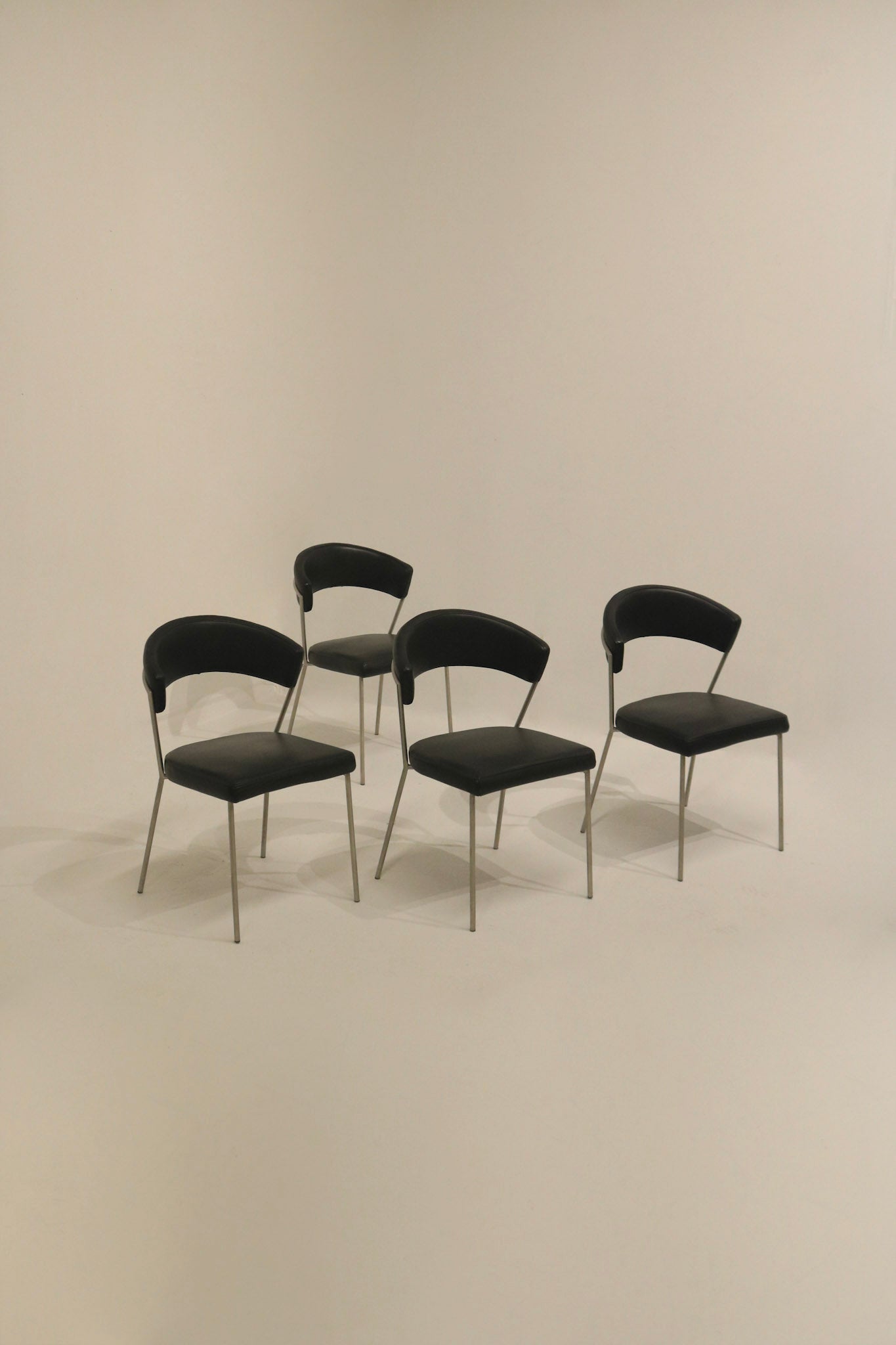 Set of 4 black vinyl dining chairs