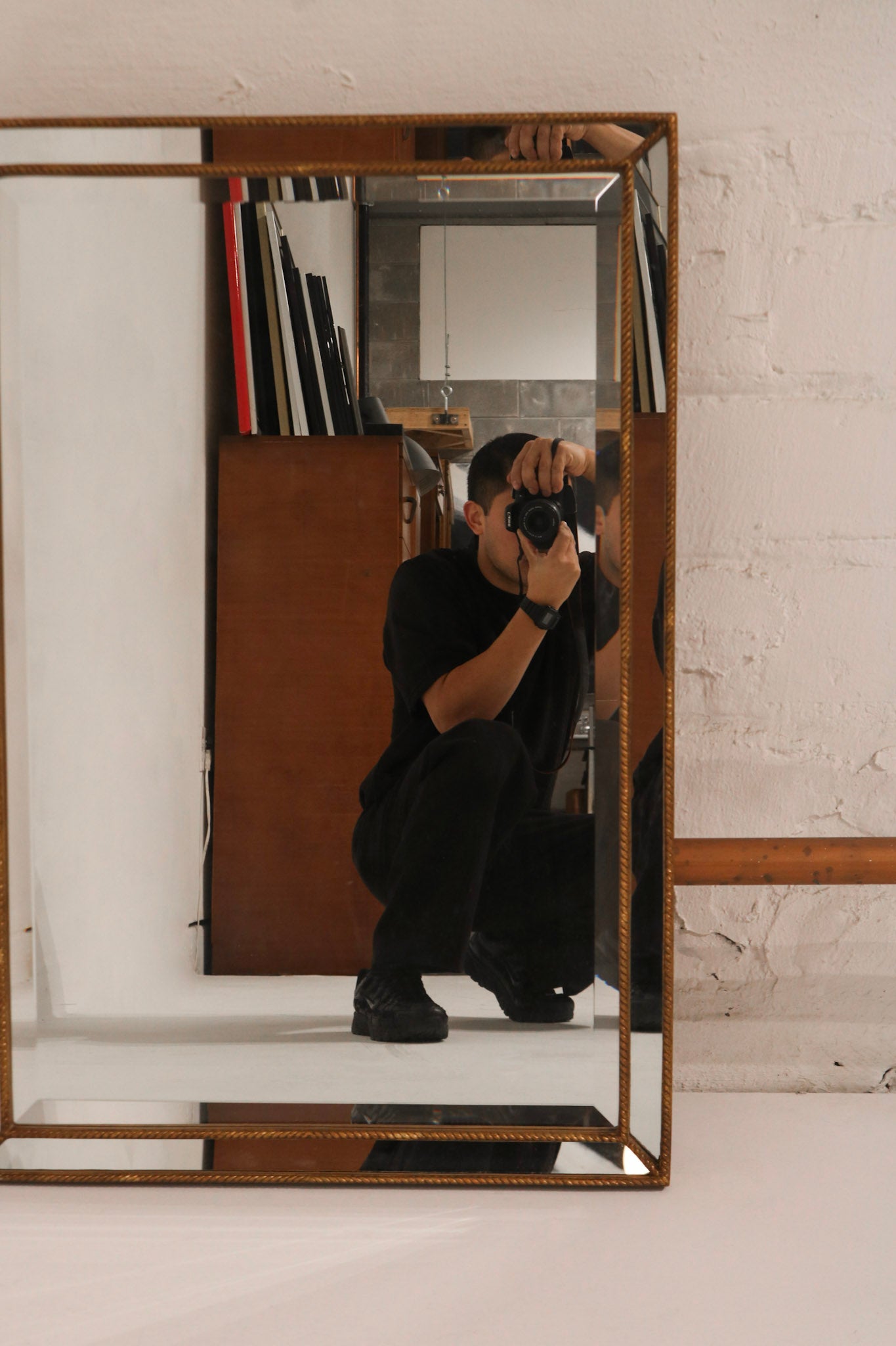 Close-up of the installed wall hanging hardware on the mirror's back, suitable for vertical or horizontal installation