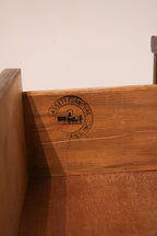 View of dresser back panel showing original construction and walnut wood tone