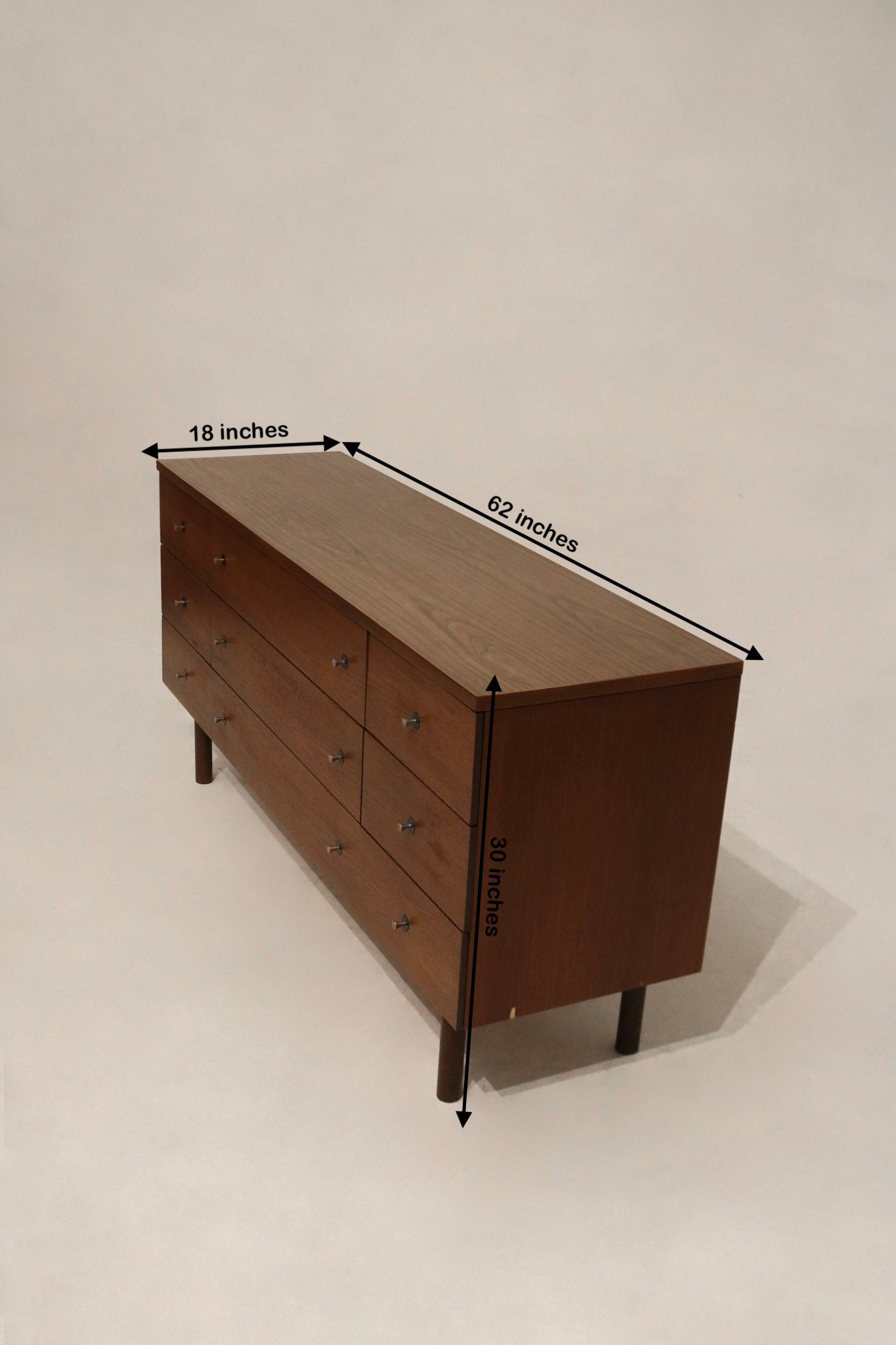 Size reference of the Mid Century Modern dresser showing dimensions 62 inches long, 18 inches deep, and 30 inches high