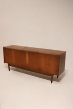 Zoomed-in image of handle and front panel texture of MCM walnut dresser