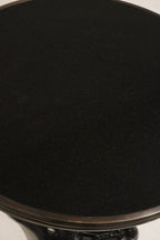 Zoomed-in image of vintage iron base foot detailing with patina finish on Bistro Table