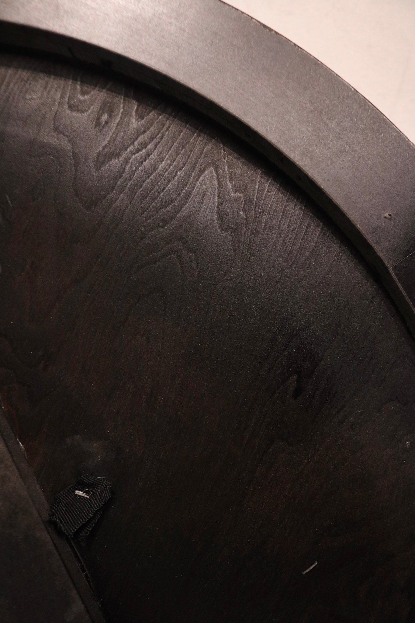 Close-up of wooden tabletop surface showing natural wood grain and minimal wear