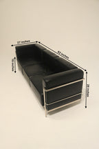 Faux leather upholstered chair inspired by Le Corbusier style
