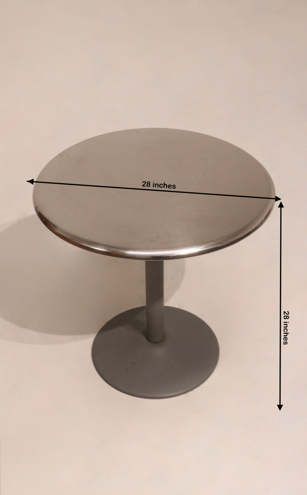 Close-up of Industrial Steel Bistro Table showing 28-inch diameter and 28-inch height dimensions