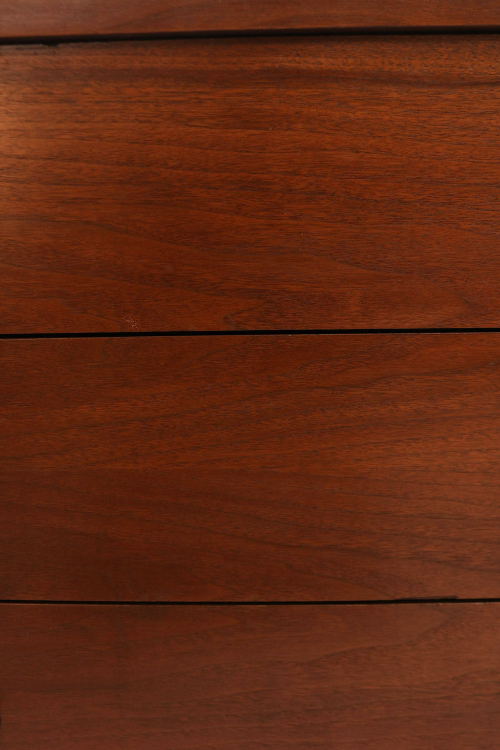 View of dresser top surface showing partial veneer with smooth, glossy finish