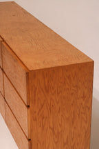 Rear view of the dresser showing particle board backing and overall construction quality