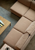 Image of missing label area on Mcm modular fabric sofa showing interior fabric, tag absence and well-built vintage frame construction