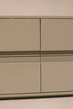 Angle view of dresser’s right side with clean lacquered wood and sleek structure