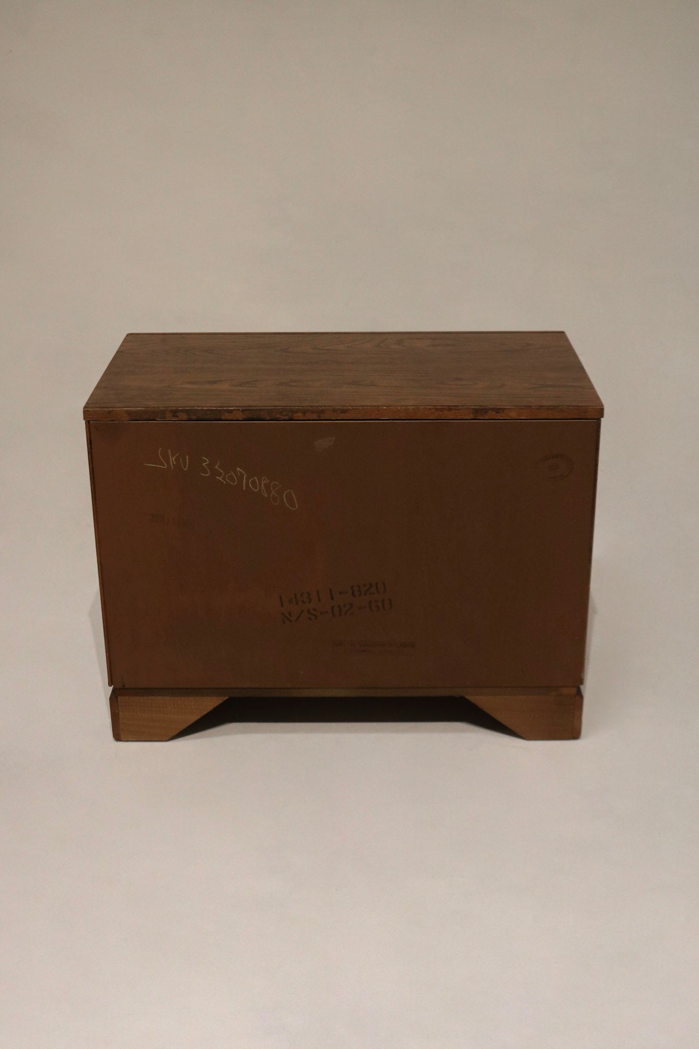 Staged pair in an interior setting to show scale and proportion, solid walnut bedside tables offering generous storage for NYC bedrooms and apartments.